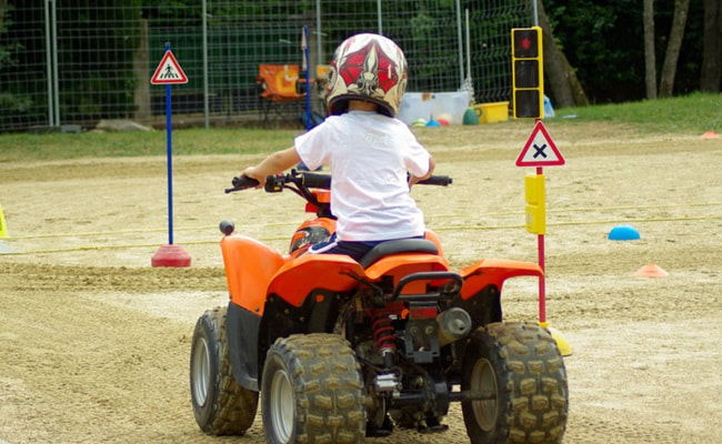 Young driver on four wheel bike