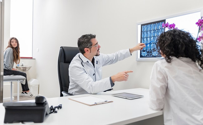 Doctor pointing at xray image