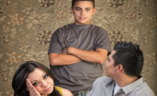 Parents looking exasperated with son